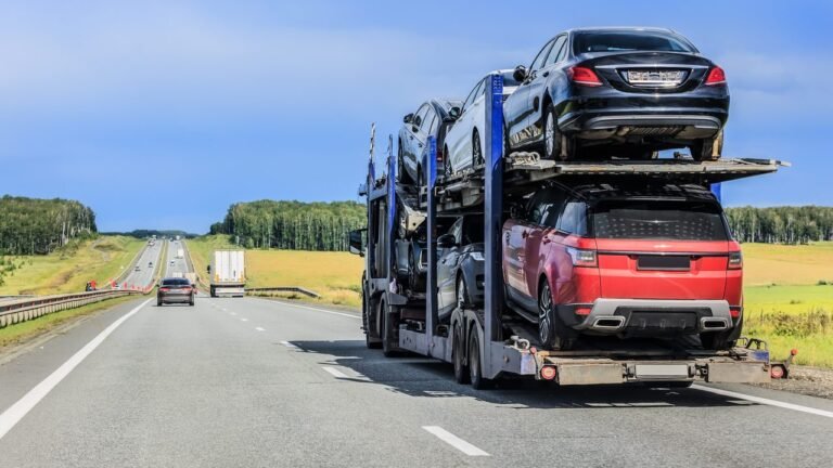 Auto transport carrier with loaded vehicles on the road