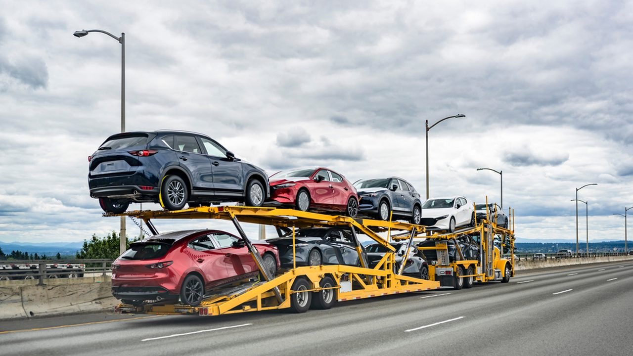 Car carrier truck transporting multiple vehicles on a highway