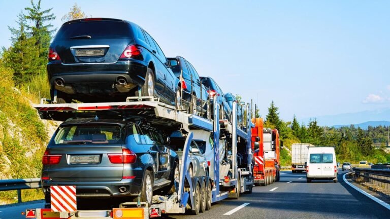 Car hauler truck driving a long cross country highway route